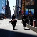 NYPD officers ride horses down a deserted 7th Ave in Times Square during the outbreak of Coronavirus disease (COVID-19), in the Manhattan borough of New York City, New York, U.S., March 26, 2020. REUTERS/Carlo Allegri