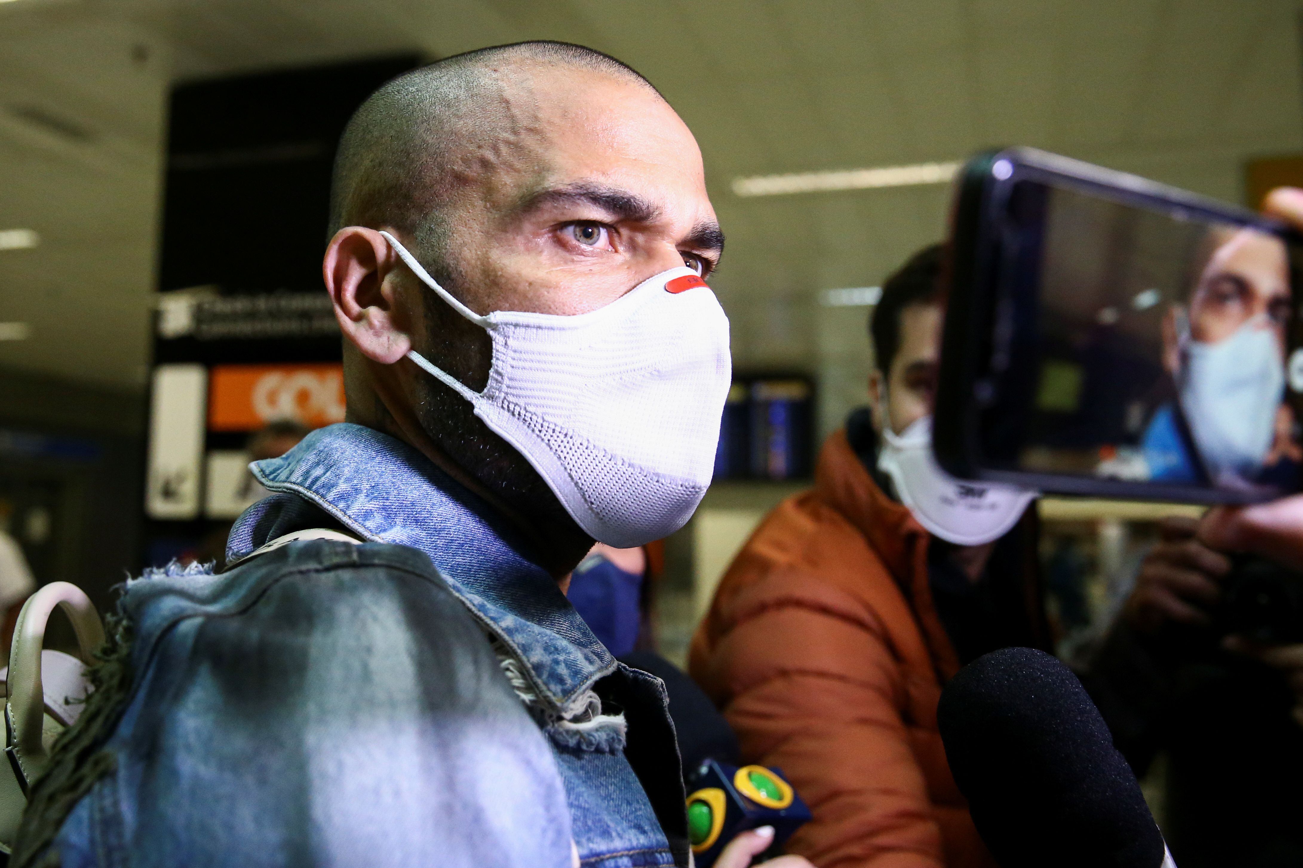 Brazilian soccer player Dani Alves, gold medalist at the Tokyo 2020 Olympics, arrives at the Guarulhos International Airport, near Sao Paulo, Brazil, August 9, 2021. REUTERS/Carla Carniel