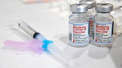 FILE - In this Jan. 9, 2021, file photo, vials of the Moderna COVID-19 vaccine are placed next to a loaded syringe in Throop, Pa. On Sunday, Jan. 17, 2021, California's state epidemiologist Dr. Erica S. Pan  recommended providers stop using lot 41L20A of the Moderna vaccine pending completion of an investigation by state officials, Moderna, the U.S. Centers for Disease Control and the federal Food and Drug Administration, because some people received medical treatment for possible severe allergic reactions. (Christopher Dolan/The Times-Tribune via AP, File)
