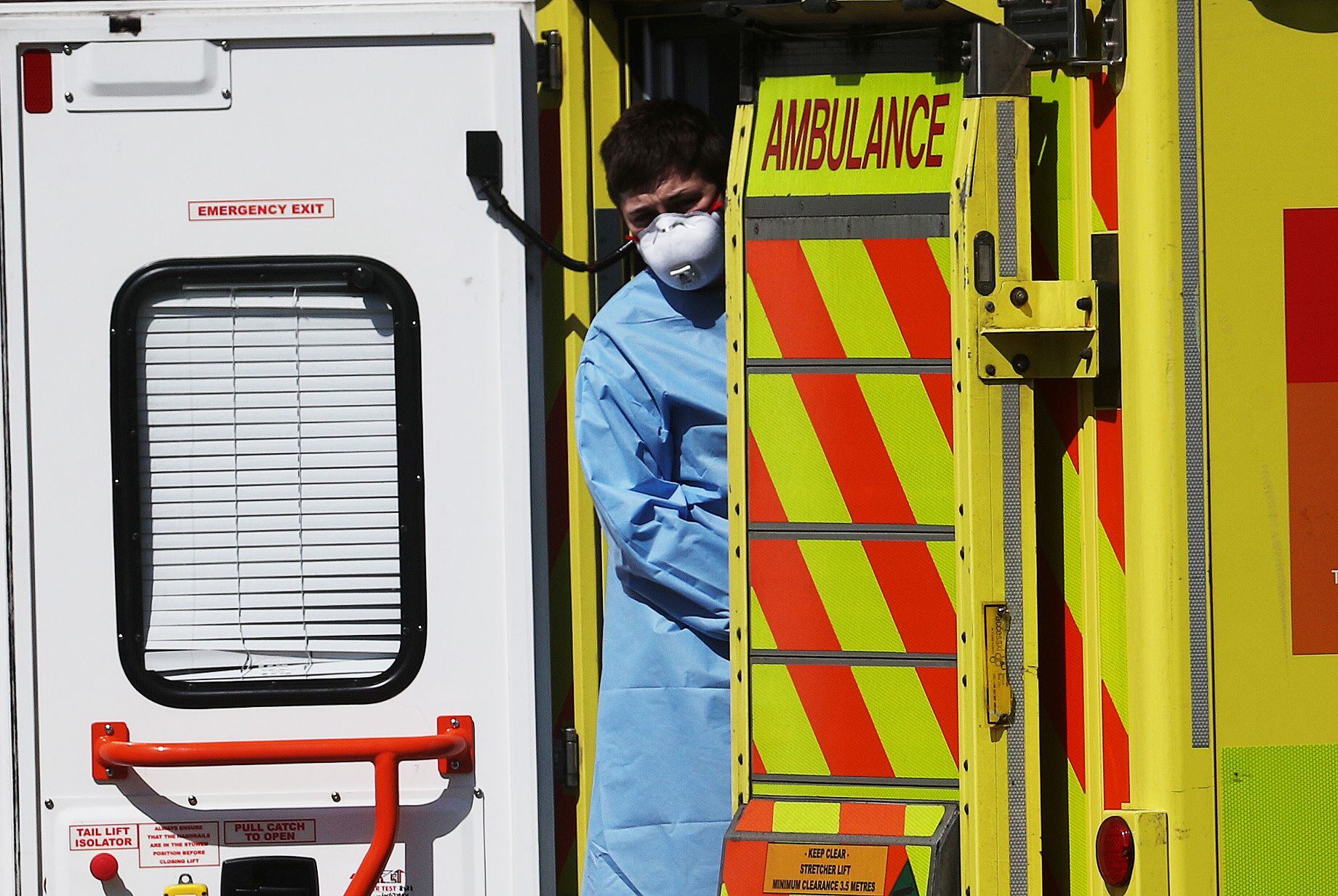 A medical worker wearing personal protective equipment (PPE) at the back of an ambulance outside Lewisham hospital as the spread of the coronavirus disease (COVID-19) continues, London, Britain, April 20, 2020. REUTERS/Hannah McKay