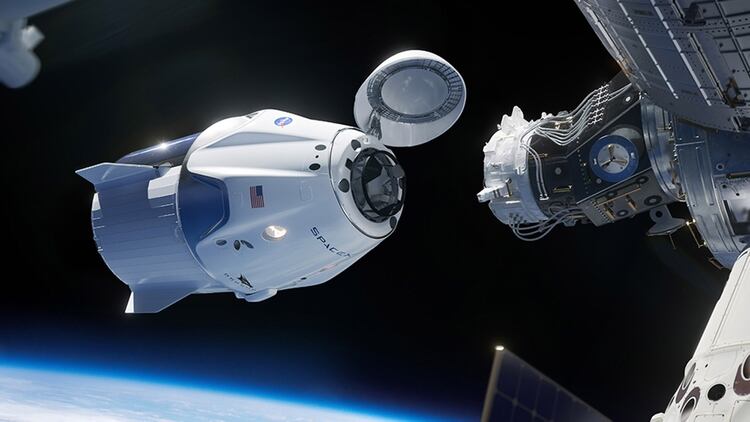 Una representación artística de la Crew Dragon acoplando a la Estación Espacial Internacional (SpaceX)