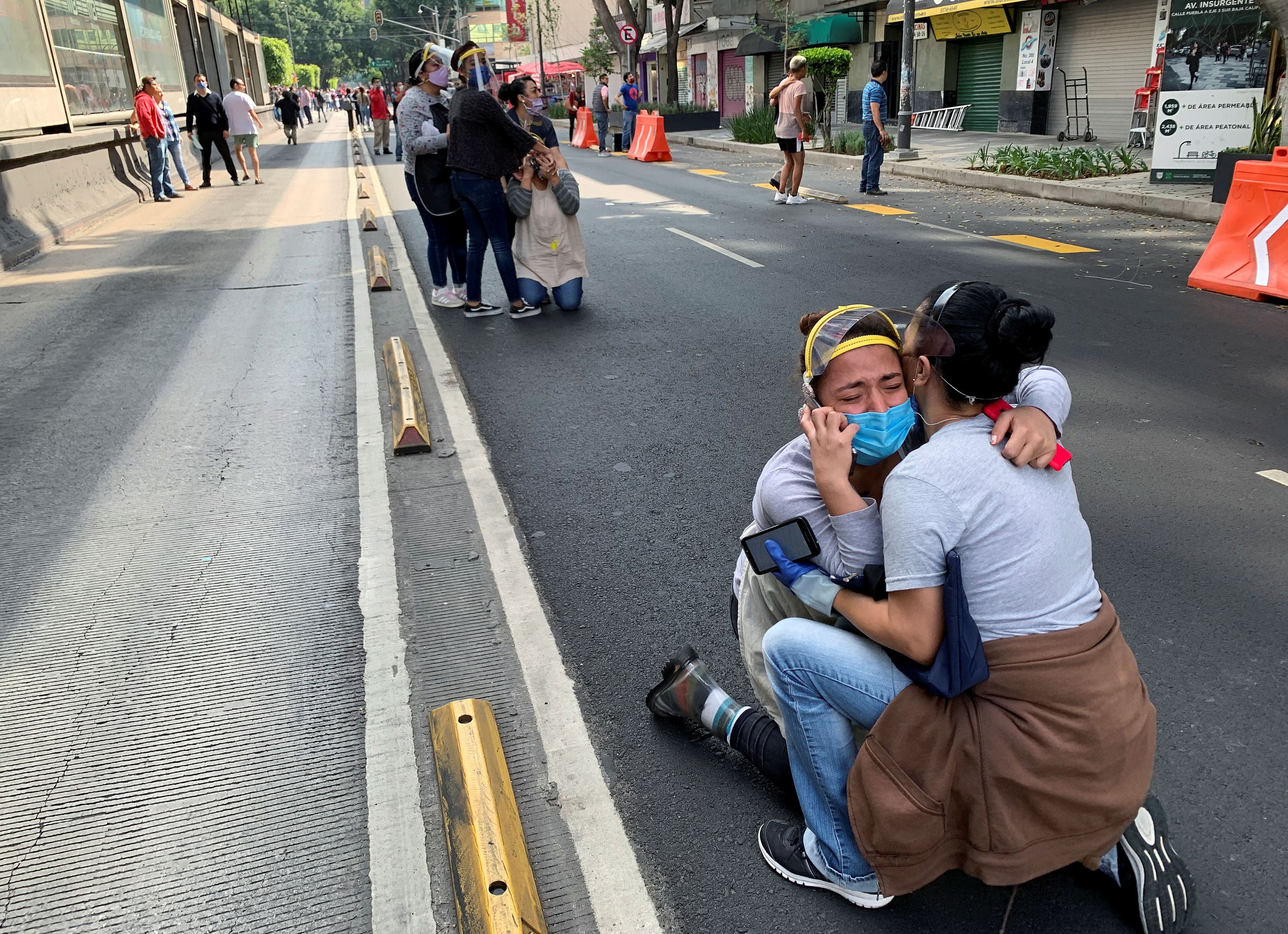 People react during an earthquake in Mexico City, Mexico June 23, 2020. REUTERS/Tomas Bravo