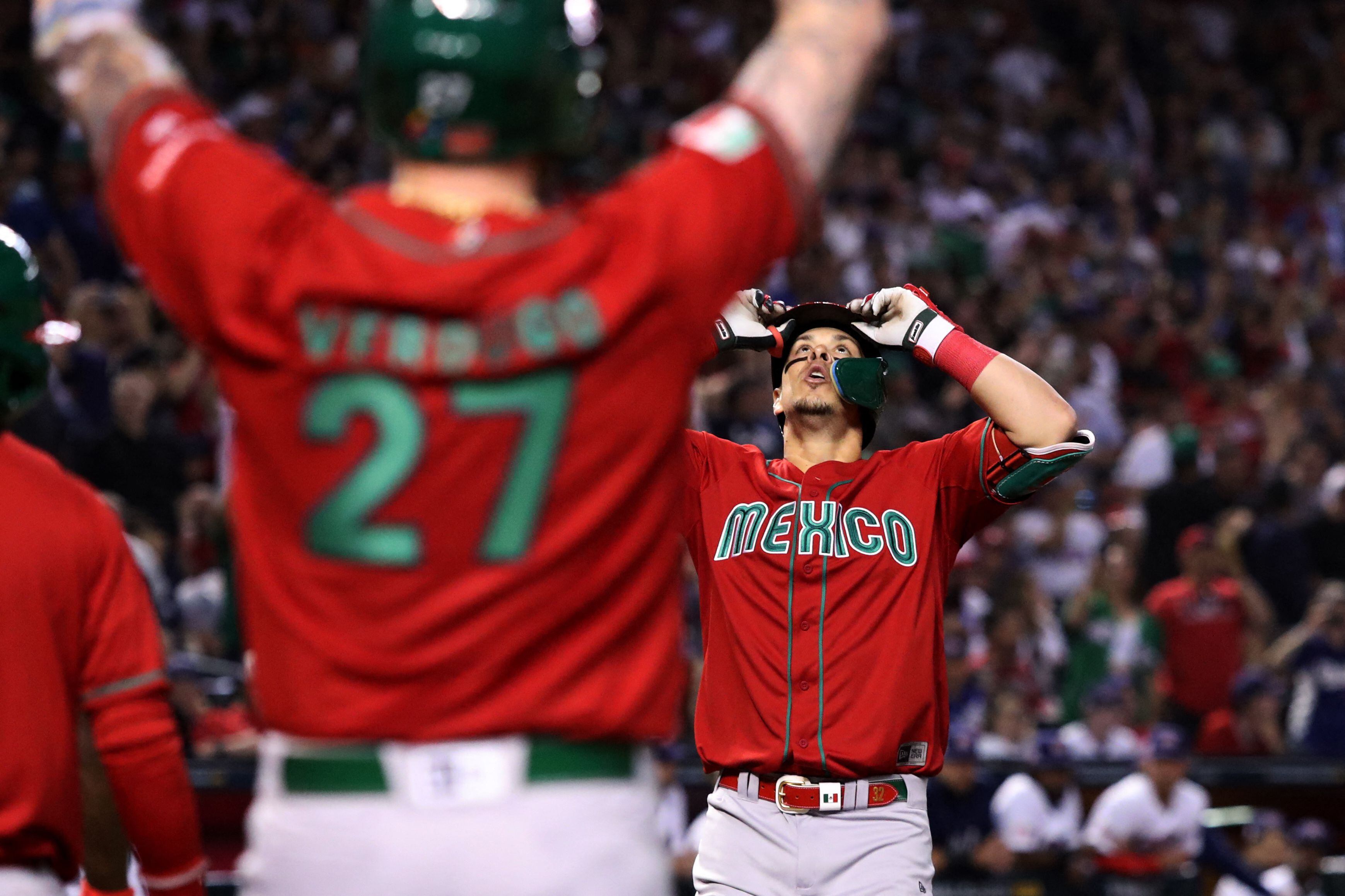 Mar 12, 2023; Phoenix, Arizona, USA; Team Mexico infielder Joey Meneses (32) celebrates a home run with Team Mexico outfielder Alex Verdugo (27) in the fourth inning against Team USA at Chase Field. Mandatory Credit: Zachary BonDurant-USA TODAY Sports