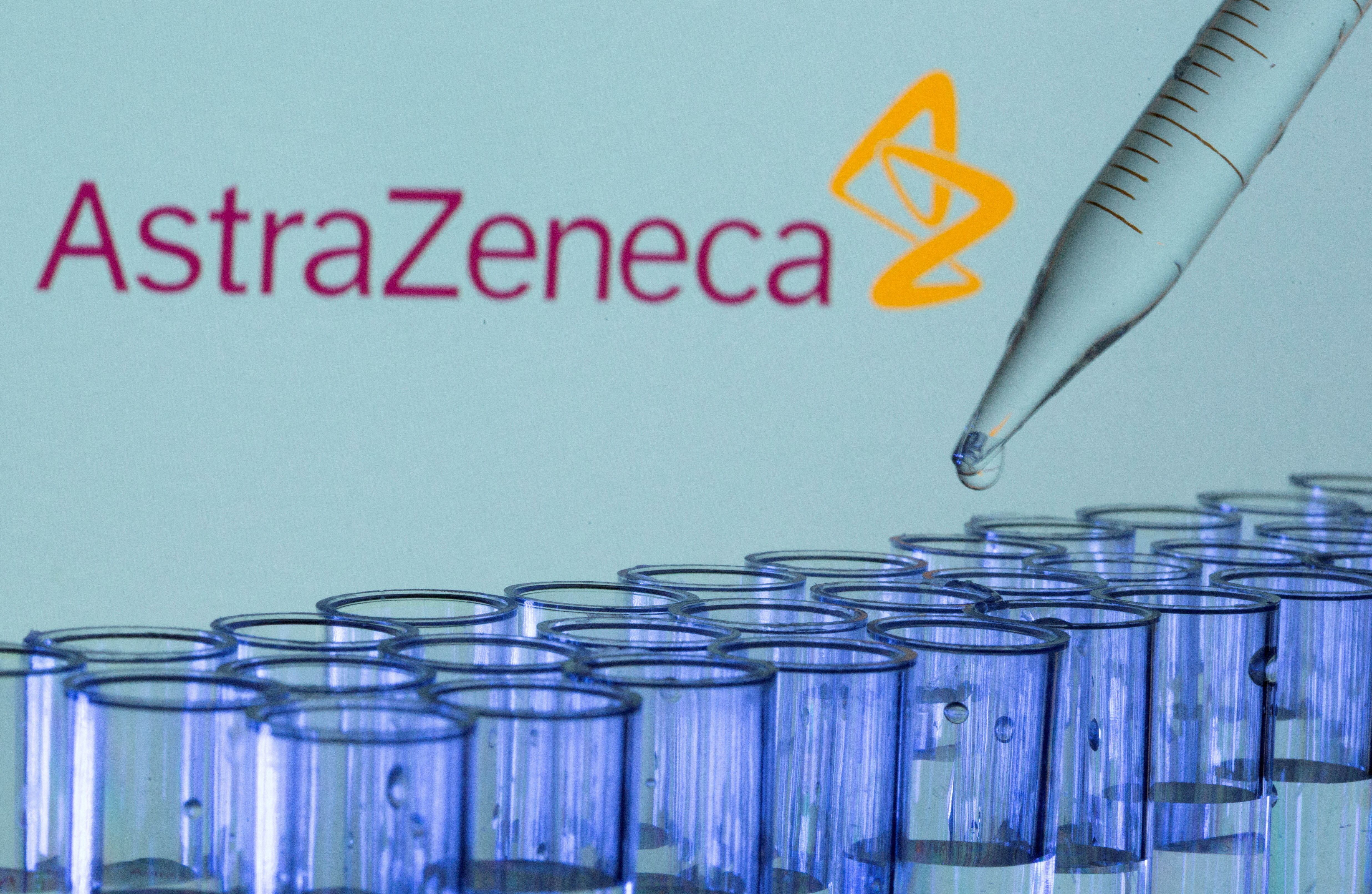 FILE PHOTO: FILE PHOTO: Test tubes are seen in front of a displayed AstraZeneca logo in this illustration taken, May 21, 2021. REUTERS/Dado Ruvic/Illustration/File Photo/File Photo