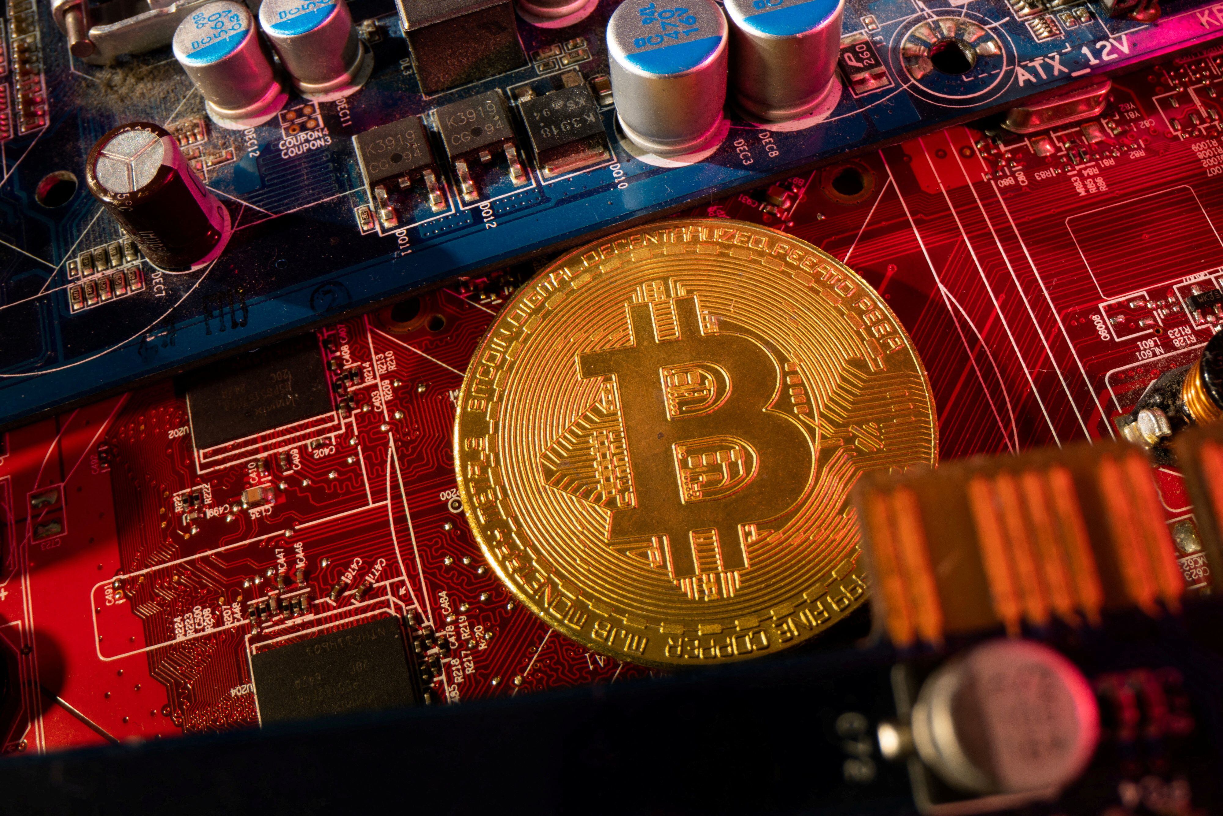 FILE PHOTO: A representation of cryptocurrency Bitcoin is placed on a PC motherboard, in this illustration taken June 16, 2023. REUTERS/Dado Ruvic/Illustration/File Photo