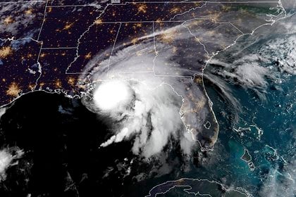 This RAMMB/NOAA satellite image shows Hurricane Sally off the US Gulf Coast on September 15, 2020, at 12:00 UTC. - Hurricane Sally is set to hit parts of the US Gulf Coast with rain for another day Tuesday before it makes landfall, raising fears that significant flooding is in store for coastal Mississippi, Alabama and the Florida Panhandle. The center of Sally -- a Category 1 storm with maximum sustained winds of 85 mph -- was moving over the Gulf of Mexico and toward coastal Mississippi only at 2 mph early Tuesday. (Photo by Handout / RAMMB/NOAA/NESDIS / AFP) / RESTRICTED TO EDITORIAL USE - MANDATORY CREDIT "AFP PHOTO / RAMMB/NOAA" - NO MARKETING - NO ADVERTISING CAMPAIGNS - DISTRIBUTED AS A SERVICE TO CLIENTS
