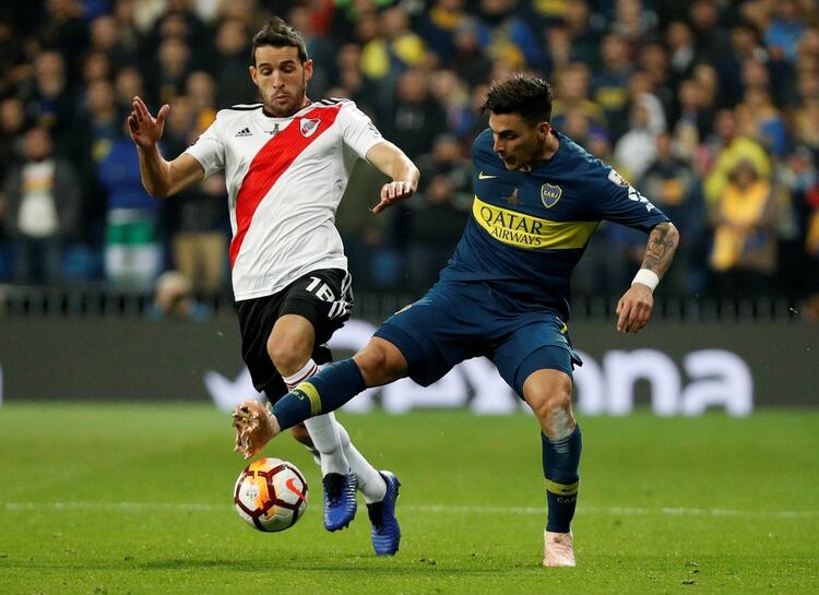 Soccer Football – Copa Libertadores Final – Second Leg – River Plate v Boca Juniors – Santiago Bernabeu, Madrid, Spain – December 9, 2018 Boca Juniors’ Cristian Pavon in action with River Plate’s Camilo Mayada REUTERS/Paul Hanna