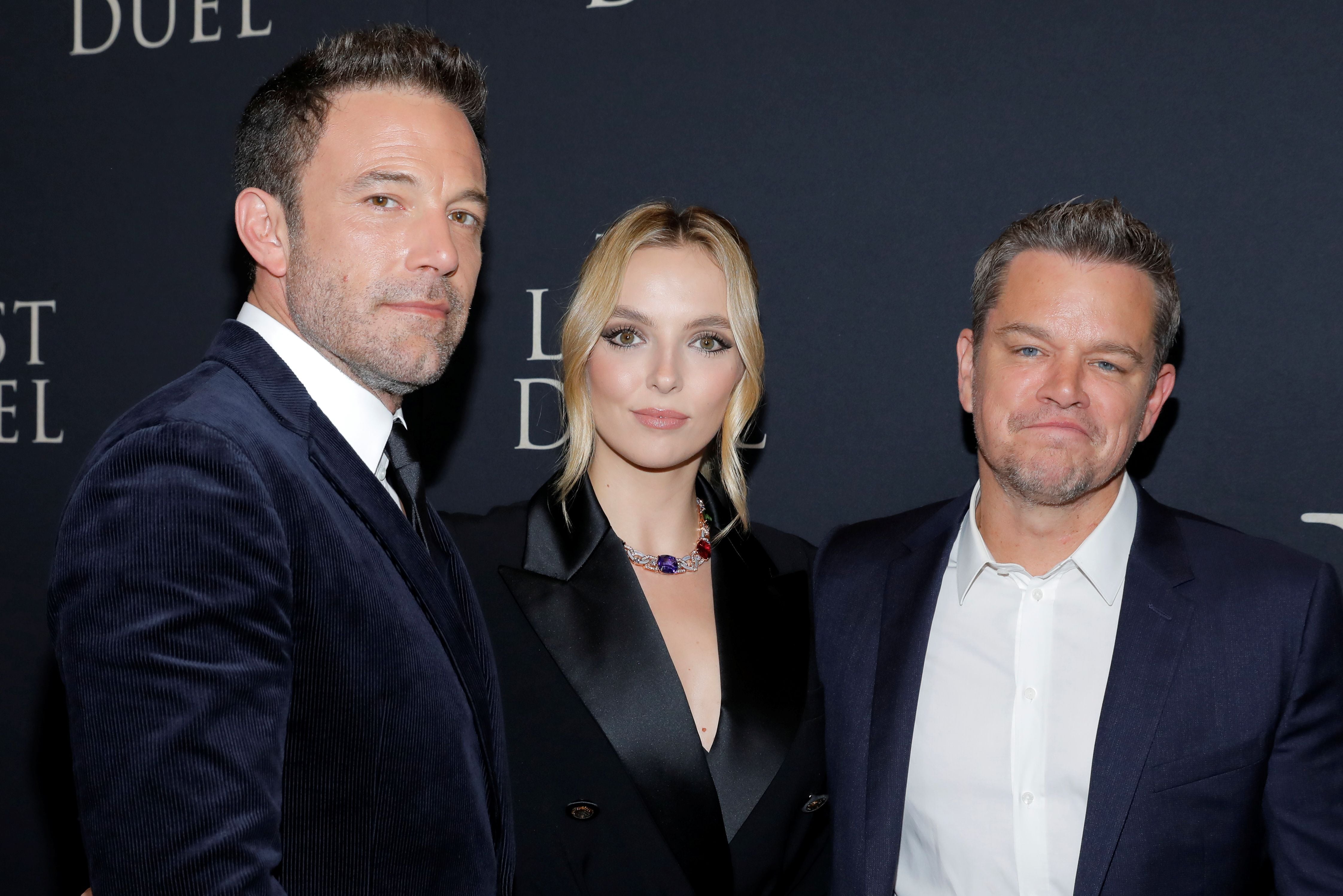 Ben Affleck, Jodie Comer and Matt Damon pose at the premiere of "The Last Duel" in Manhattan, New York, U.S., October 9, 2021. REUTERS/Andrew Kelly