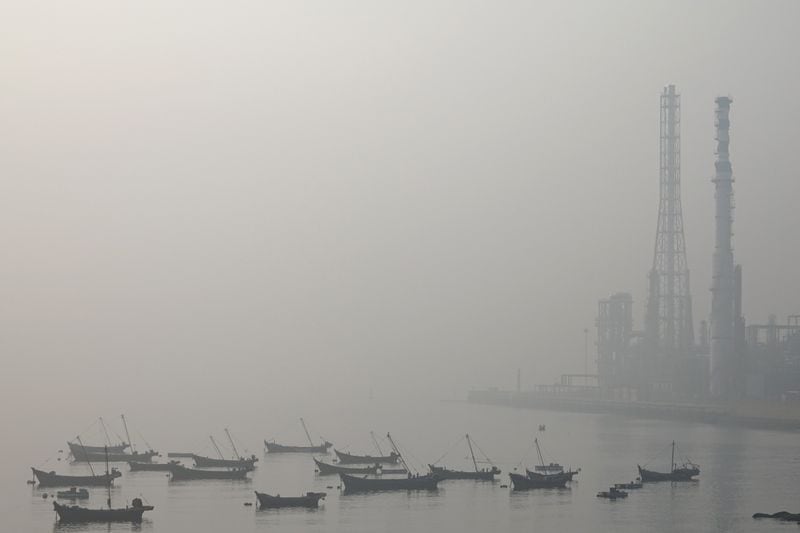 PHOTO FILE: Several boats moored in the Bay of Dalian, surrounded by mist on a day of high air pollution in Liaoning province, China, on October 22, 2019. REUTERS/Stringer