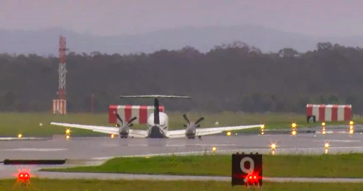 A plane carrying three people without wheels has landed at an Australian airport