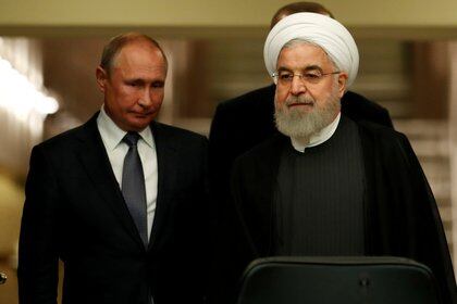 FILE PHOTO: Presidents Hassan Rouhani of Iran and Vladimir Putin of Russia arrive for a news conference in Ankara, Turkey, September 16, 2019. REUTERS/Umit Bektas/File Photo