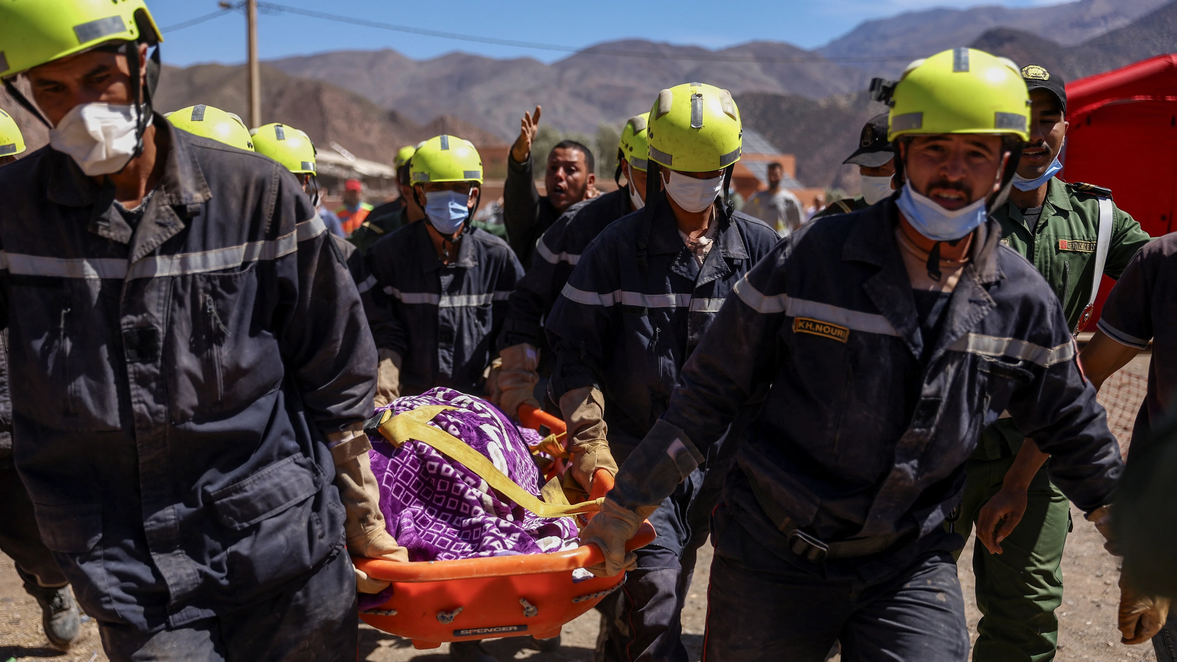 Rescue workers carry the dead body of a victim of the deadly earthquake in Talat N'yaaqoub, Morocco, September 11, 2023. REUTERS/Hannah McKay