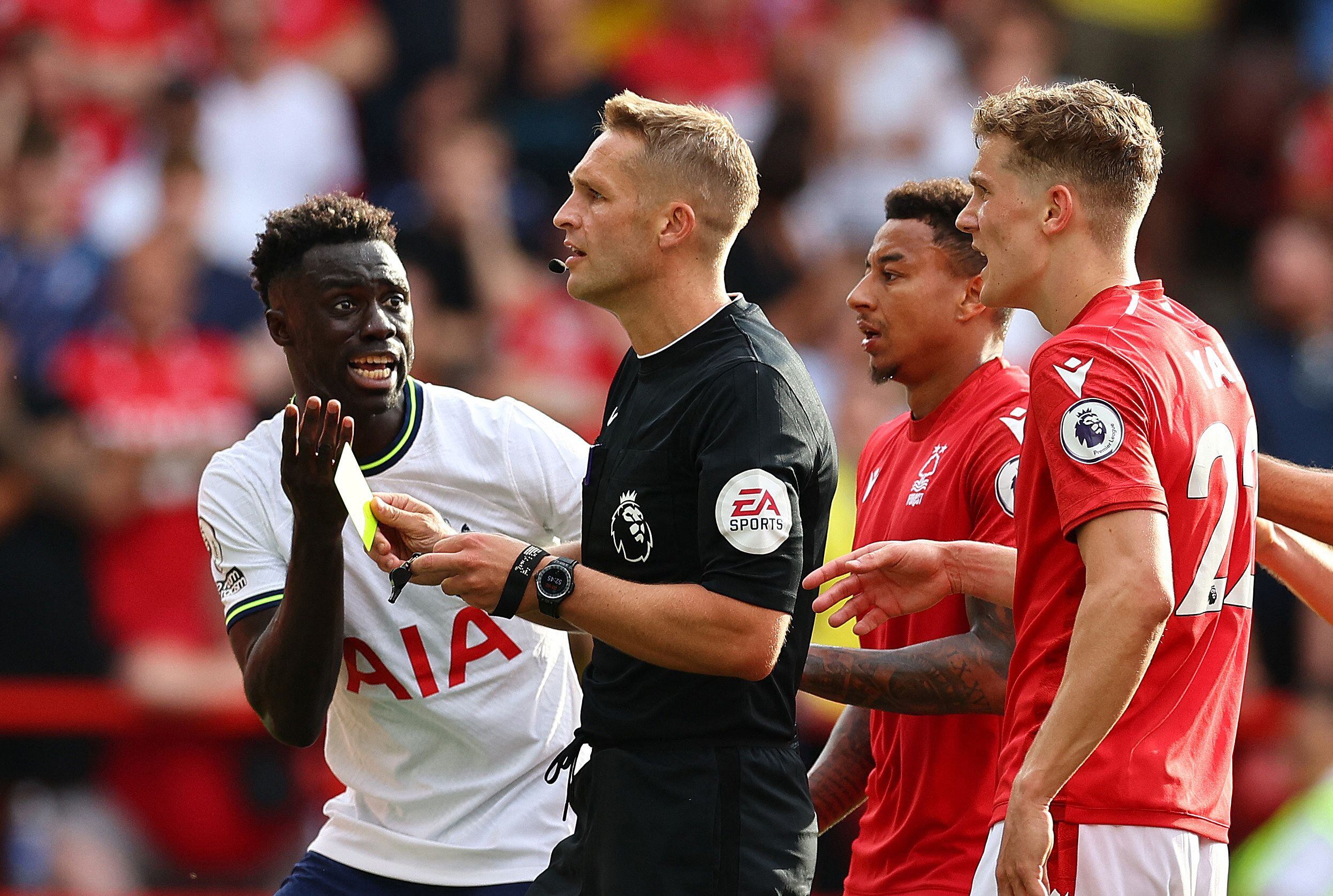 Soccer Football - Premier League - Nottingham Forest v Tottenham Hotspur - The City Ground, Nottingham, Britain - August 28, 2022 Tottenham Hotspur's Davinson Sanchez reacts as referee Craig Pawson shows a yellow card REUTERS/David Klein EDITORIAL USE ONLY. No use with unauthorized audio, video, data, fixture lists, club/league logos or 'live' services. Online in-match use limited to 75 images, no video emulation. No use in betting, games or single club /league/player publications.  Please contact your account representative for further details.