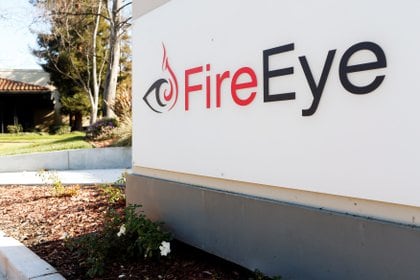 FILE PHOTO: The FireEye logo is seen outside the company's offices in Milpitas, California, December 29, 2014. REUTERS/Beck Diefenbach/File Photo