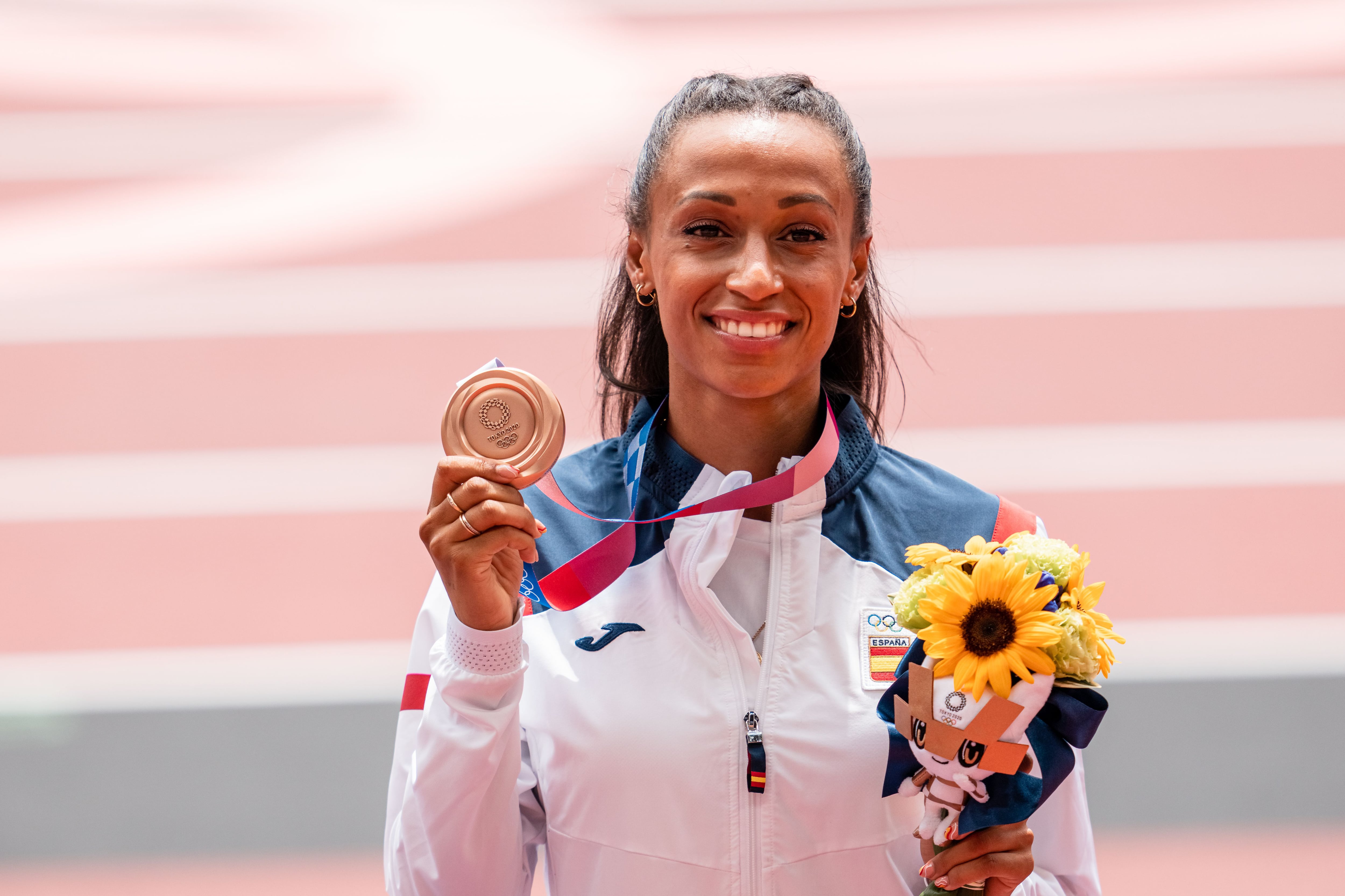 Ana Peleteiro poses with her triple jump bronze medal from the 2020 Tokyo Olympics.
