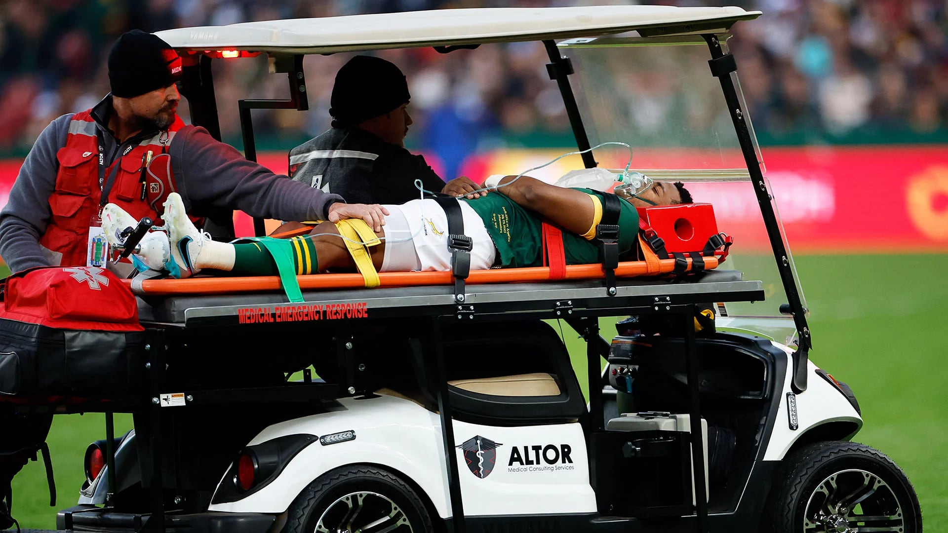 South Africa's scrumhalf Grant Williams (C) is evacuated by medical personnel on a stretcher placed on a vehicle after being injured during the Rugby Championship final-round match between South Africa and Argentina at Ellis Park in Johannesburg on July 29, 2023. (Photo by WIKUS DE WET / AFP)