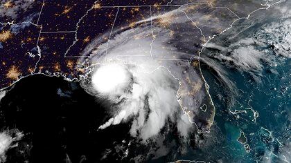 This RAMMB/NOAA satellite image shows Hurricane Sally off the US Gulf Coast on September 15, 2020, at 12:00 UTC. - Hurricane Sally is set to hit parts of the US Gulf Coast with rain for another day Tuesday before it makes landfall, raising fears that significant flooding is in store for coastal Mississippi, Alabama and the Florida Panhandle. The center of Sally -- a Category 1 storm with maximum sustained winds of 85 mph -- was moving over the Gulf of Mexico and toward coastal Mississippi only at 2 mph early Tuesday. (Photo by Handout / RAMMB/NOAA/NESDIS / AFP) / RESTRICTED TO EDITORIAL USE - MANDATORY CREDIT "AFP PHOTO / RAMMB/NOAA" - NO MARKETING - NO ADVERTISING CAMPAIGNS - DISTRIBUTED AS A SERVICE TO CLIENTS