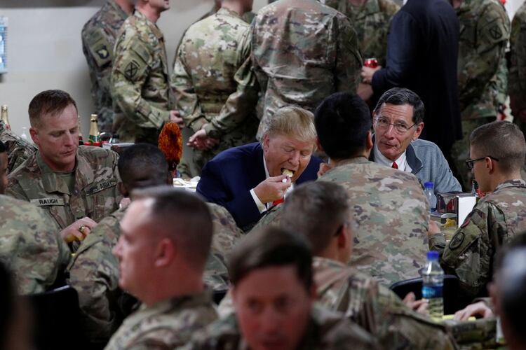 Donald Trump traveled by surprise to Afghanistan to share Thanksgiving dinner with US troops