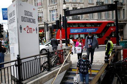 People walk on a street near the Oxford Circus station, amid the coronavirus disease (COVID-19) outbreak in London, Britain, June 29, 2020. REUTERS/Henry Nicholls