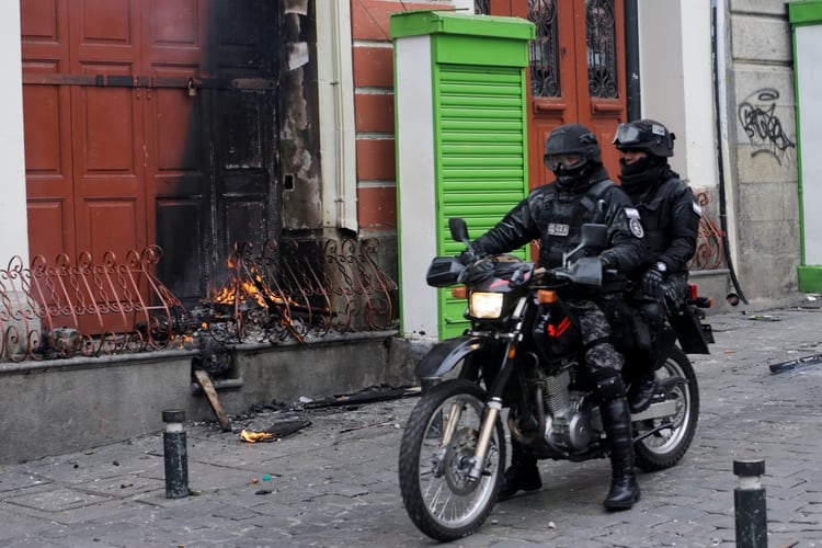 Members of the security forces ride a motorcycle during clashes with supporters of former Bolivian President Evo Morales, in La Paz, Bolivia November 13, 2019. REUTERS/David Mercado