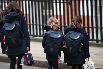 Children after leaving a school in Westminster as the majority of schools in the UK close while the spread of the coronavirus disease (COVID-19) continues. In Westminster, London, Britain March 20, 2020. REUTERS/Hannah McKay