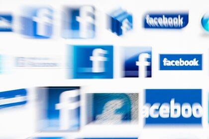 FILE PHOTO: Facebook logos on a computer screen are seen in this photo illustration taken in Lavigny May 16, 2012.  REUTERS/Valentin Flauraud/File Photo