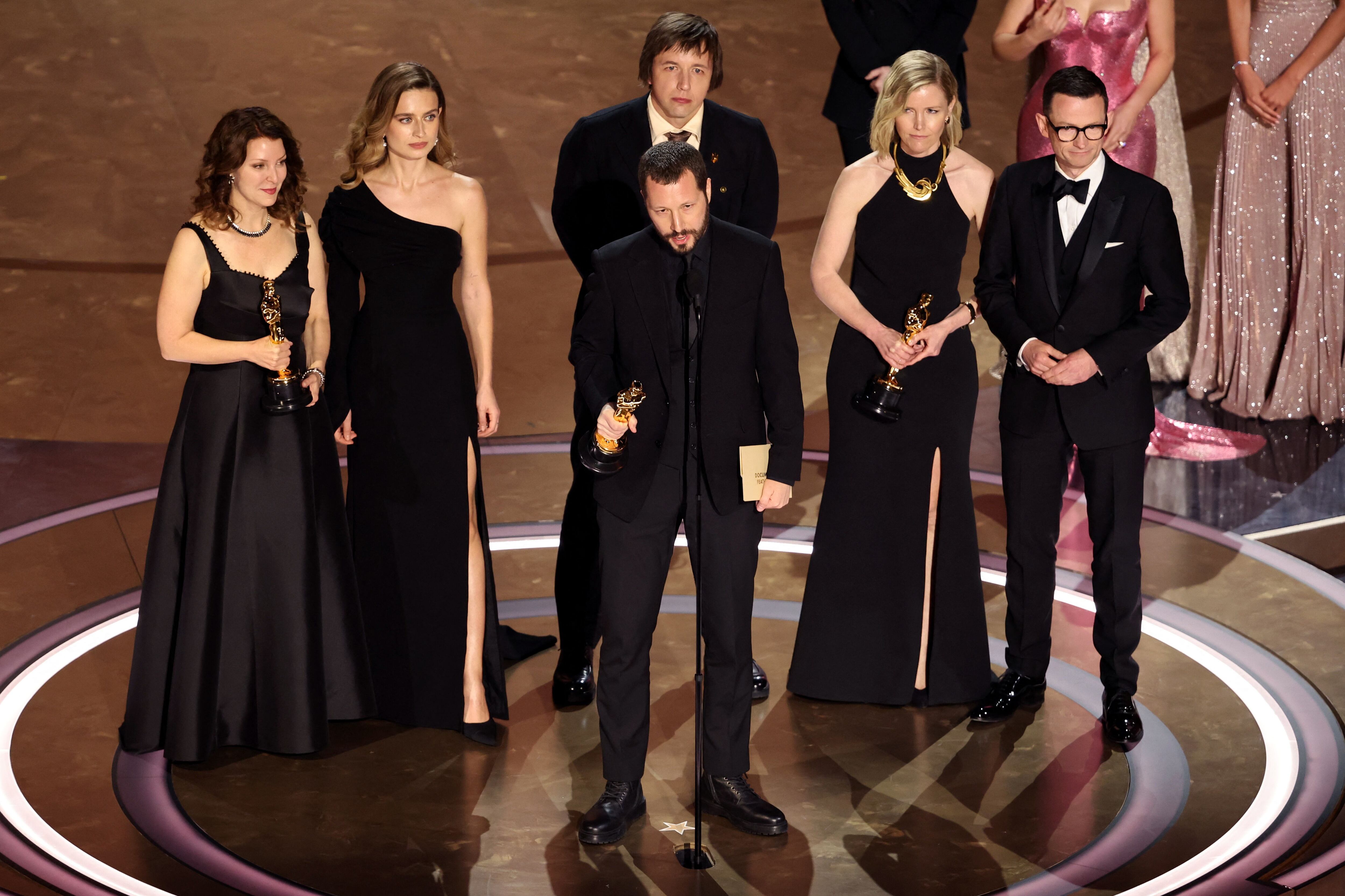 Director Mstyslav Chernov and producers Michelle Mizner and Raney Aronson-Rath win the Oscar for Best Documentary Feature Film for "20 Days in Mariupol" during the Oscars show at the 96th Academy Awards in Hollywood, Los Angeles, California, U.S., March 10, 2024. REUTERS/Mike Blake