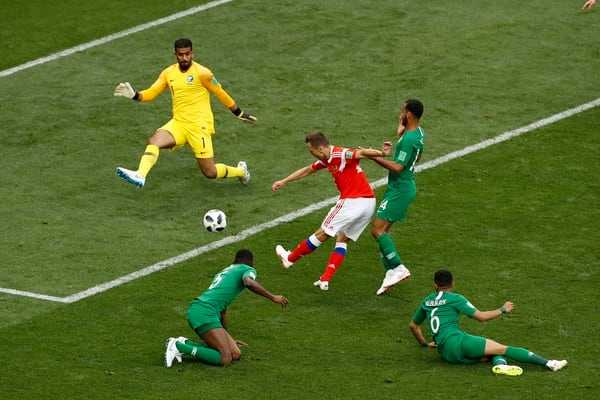 Russia’s Denis Cheryshev, center, scores his side’s second goal during the group A match between Russia and Saudi Arabia which opens the 2018 soccer World Cup at the Luzhniki stadium in Moscow, Russia, Thursday, June 14, 2018. (AP Photo/Darko Bandic)