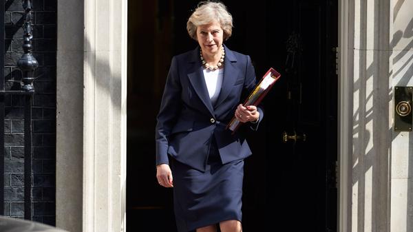(AFP) Theresa May