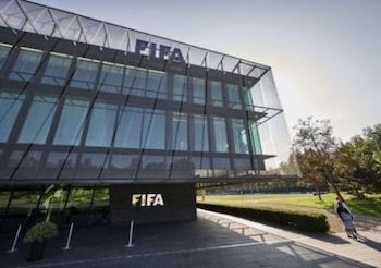 A journalist stands in front