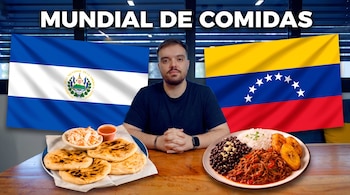 Un hombre sentado frente a un plato de pupusas y un plato de pabellón criollo, flanqueado por las banderas de El Salvador y Venezuela.