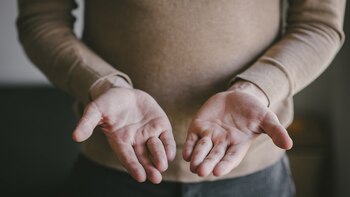 Man in brown sweater offers