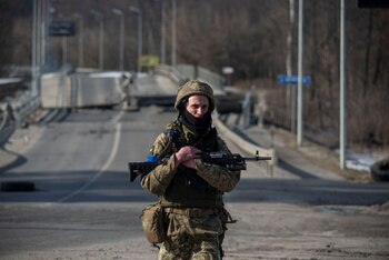 A Ukrainian service member walks