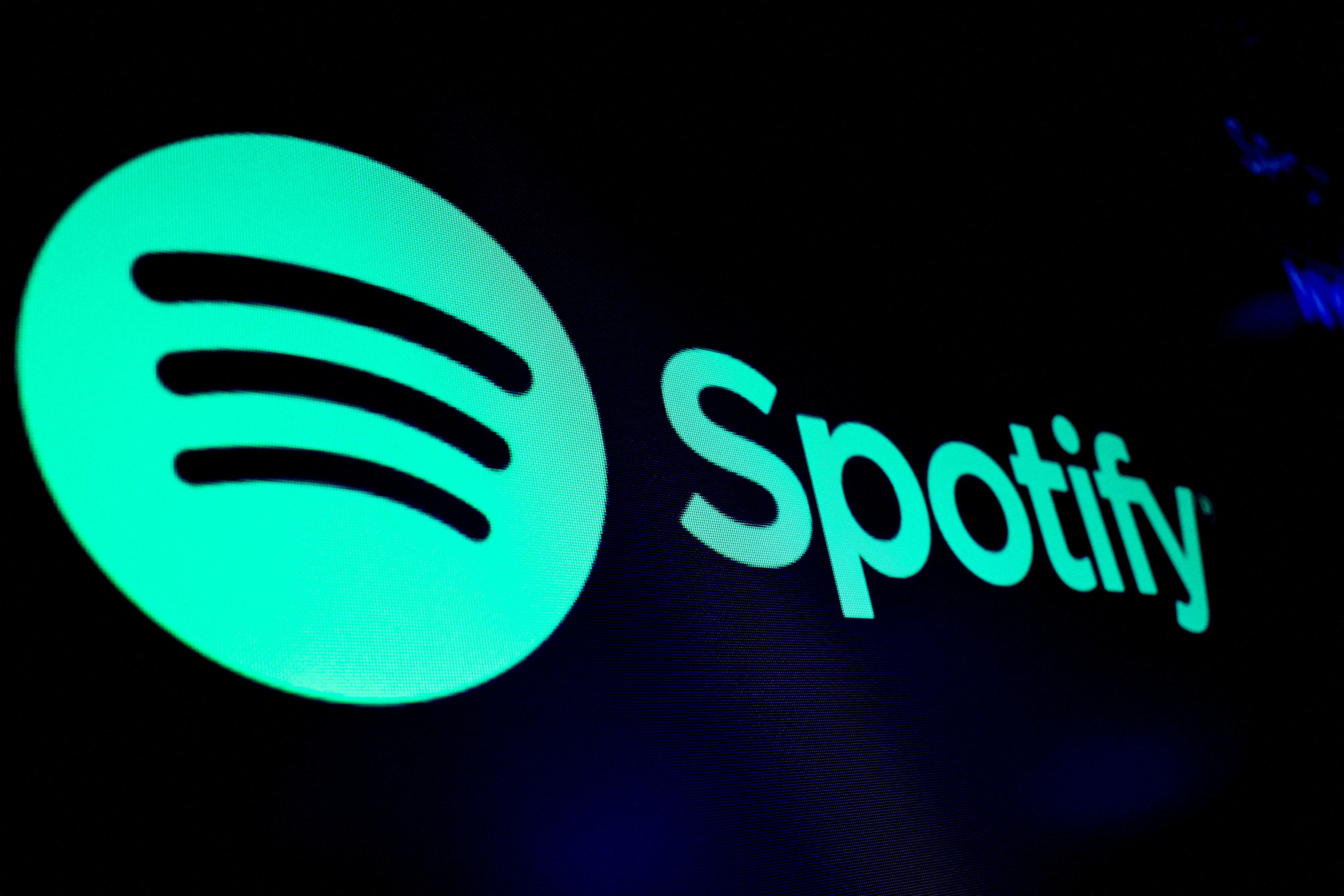 FILE PHOTO: A screen displays the logo of Spotify on the floor at the New York Stock Exchange (NYSE) in New York City, U.S., December 4, 2023. REUTERS/Brendan McDermid/File Photo