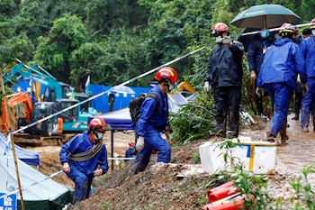 FILE PHOTO: Rescue workers work