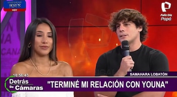 Renato Rossini Jr. habla por un micrófono junto a Samahara Lobatón, ambos sentados en un estudio de televisión. Él tiene cabello rizado y ella liso, con fondo rojo y púrpura