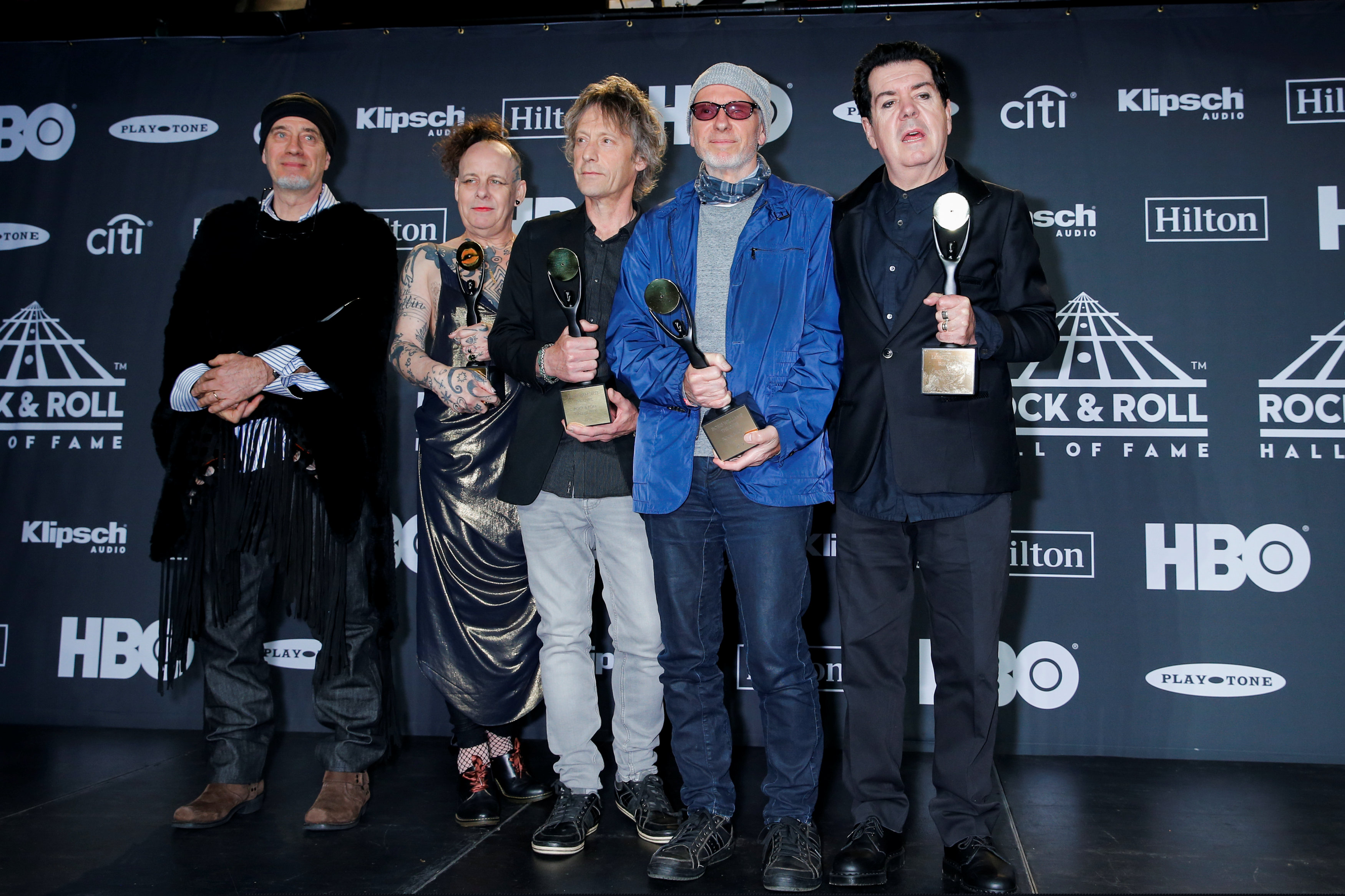 Inductees Michael Dempsey, Pearl Thompson, Perry Bamonte, Boris Williams, Lol Tolhurst of The Cure pose for pictures at the press room during the 2019 Rock and Roll Hall of Fame induction ceremony in Brooklyn, New York, U.S., March 29, 2019. REUTERS/Eduardo Munoz