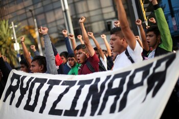 FILE PHOTO: Students participate in a march in Mexico City to mark the 65th month since the disappearance of the 43 missing Ayotzinapa College Raul Isidro Burgos students in the state of Guerrero, Mexico, February 26, 2020. REUTERS/Edgard Garrido/File Photo
