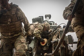 December 2, 2018 - Iraq: A U.S. Army Soldier assigned to the 3rd Cavalry Regiment loads propellant into the M777 Howitzer during a fire mission in Southwest Asia. 3rd Cav. Regt. is part of Combined Joint Task Force - Operation Inherent Resolve, supporting the Syrian Democratic Forces as they clear the last remaining pockets of ISIS from the Middle Euphrates River Valley and prevent them from fleeing into Iraq. In conjunction with partner forces, Combined Joint Task Force - Operation Inherent Resolve defeats ISIS in designated areas of Iraq and Syria and sets conditions for follow-on operations to increase regional stability. (Mikki L. Sprenkle/US Army/Polaris)
