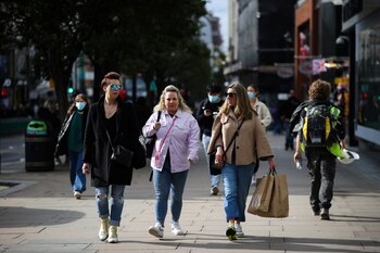 Shoppers walk down Oxford Street,