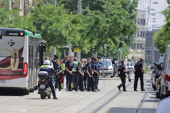 Police officers stand guard near