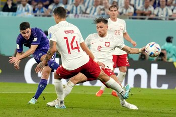 Argentina's Julian Alvarez, left, scores