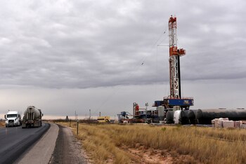 FILE PHOTO: A drilling rig operates in the Permian Basin oil and natural gas production area in Lea County, New Mexico, U.S., February 10, 2019. REUTERS/Nick Oxford//File Photo/File Photo