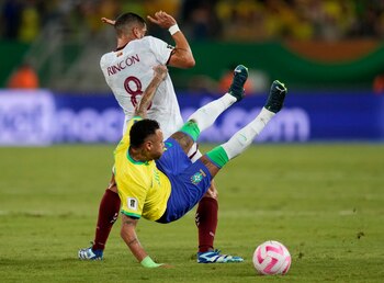Brazil's Neymar, bottom, and Venezuela's