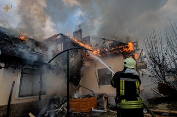 A residential house burns after