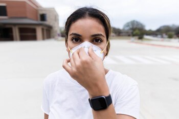 The mid adult woman adjusts