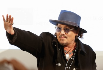 Johnny Depp waves as he present "Modi, three days on the wing of madness" his second film as director, at Seville’s European Film Festival in Seville, Spain, November 9, 2024. REUTERS/Marcelo del Pozo
