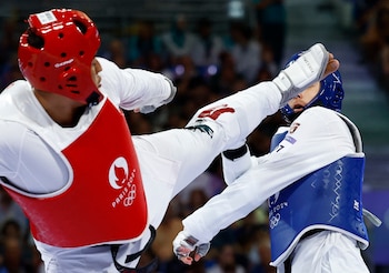 Paris 2024 Olympics - Taekwondo - Men +80kg Repechage - Grand Palais, Paris, France - August 10, 2024. Carlos Sansores of Mexico in action with Nikita Rafalovich of Uzbekistan. REUTERS/Albert Gea