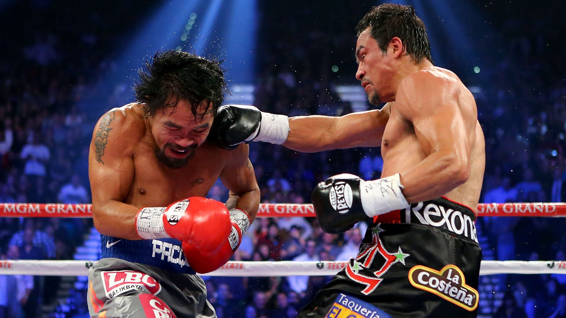 LAS VEGAS, NV - DECEMBER 08: (R-L) Juan Manuel Marquez lands a right to the face of Manny Pacquiao during their welterweight bout at the MGM Grand Garden Arena on December 8, 2012 in Las Vegas, Nevada. (Photo by Al Bello/Getty Images)
