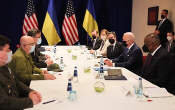 U.S. President Joe Biden joins a meeting between U.S. Secretary of State Antony Blinken, U.S. Secretary of Defense Lloyd Austin, Ukrainian Foreign Minister Dmytro Kuleba and Ukrainian Defense Minister Oleksii Reznikov, amid Russia's invasion of Ukraine, at the Marriott Hotel, in Warsaw, Poland March 26, 2022. REUTERS/Evelyn Hockstein